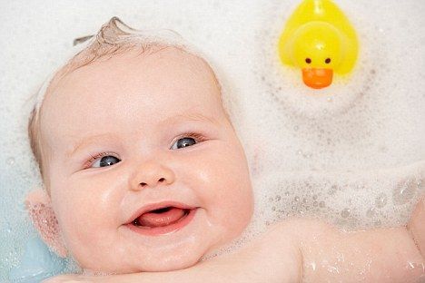 Baby Having Bath At Home